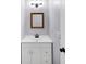 Charming powder room featuring a vanity with storage, attractive mirror, and modern fixtures at 3458 Cooper St, Lithia Springs, GA 30122