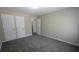 Bedroom featuring neutral-toned walls and two closets at 1349 Cedar Heights Dr, Stone Mountain, GA 30083