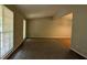 Bright living room with large windows and carpeted floors at 1349 Cedar Heights Dr, Stone Mountain, GA 30083