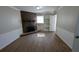 Bright living room features a brick fireplace and built-in shelves for storage at 1349 Cedar Heights Dr, Stone Mountain, GA 30083