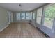 Enclosed sunroom or porch with tile flooring and many windows to allow natural light at 1349 Cedar Heights Dr, Stone Mountain, GA 30083
