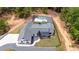 Aerial view of modern home with dark roof, black fence, in ground swimming pool, and spacious yard at 16 Mountain Creek Ne Trl, Fairmount, GA 30139