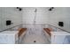Bathroom with a large walk-in shower featuring dual shower heads and built in benches at 16 Mountain Creek Ne Trl, Fairmount, GA 30139