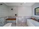 Bathroom with a large walk-in shower featuring a built in bench and soaking tub at 16 Mountain Creek Ne Trl, Fairmount, GA 30139