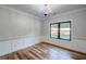 Bright, airy bedroom featuring hardwood floors and a large window with natural light at 16 Mountain Creek Ne Trl, Fairmount, GA 30139