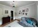 Cozy bedroom area with a colorful chandelier, and hardwood floors at 16 Mountain Creek Ne Trl, Fairmount, GA 30139