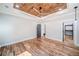 Bedroom with a decorative wood ceiling, fan, hardwood floors and access to a walk-in closet at 16 Mountain Creek Ne Trl, Fairmount, GA 30139