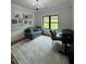 Comfortable bedroom featuring a large window, stylish decor, and a cozy atmosphere at 16 Mountain Creek Ne Trl, Fairmount, GA 30139