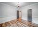 Bright, airy bedroom featuring hardwood floors and a view to the back yard at 16 Mountain Creek Ne Trl, Fairmount, GA 30139