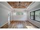 Bright bedroom with a decorative wood ceiling, fan, natural lighting, hardwood floors, and wainscotting at 16 Mountain Creek Ne Trl, Fairmount, GA 30139