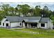 Beautiful single-story home with white brick, black accents, and a well-manicured lawn at 16 Mountain Creek Ne Trl, Fairmount, GA 30139