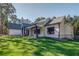 Angle view of home showing siding, brickwork, landscaping, and three-car garage at 16 Mountain Creek Ne Trl, Fairmount, GA 30139
