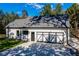 Beautiful home exterior and curb appeal featuring a modern garage with black and white detailing at 16 Mountain Creek Ne Trl, Fairmount, GA 30139