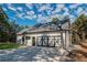 A modern garage door in black and white, complementing the home's exterior and spacious driveway at 16 Mountain Creek Ne Trl, Fairmount, GA 30139