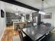 Open-concept kitchen with stainless appliances, custom cabinets, and granite island open to a large dining area at 16 Mountain Creek Ne Trl, Fairmount, GA 30139