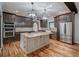 Modern kitchen with stainless steel appliances, granite countertops and a large kitchen island at 16 Mountain Creek Ne Trl, Fairmount, GA 30139