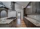 Modern kitchen featuring custom cabinets, granite countertops, and a stainless steel range hood at 16 Mountain Creek Ne Trl, Fairmount, GA 30139