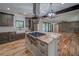 Well-lit kitchen featuring granite countertops, stainless steel appliances, and a view to the great room at 16 Mountain Creek Ne Trl, Fairmount, GA 30139