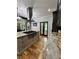 Gourmet kitchen featuring stainless steel appliances, granite countertops, and a large central island cooktop at 16 Mountain Creek Ne Trl, Fairmount, GA 30139