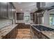 Well-designed kitchen featuring stainless steel appliances, granite countertops and wooden cabinets at 16 Mountain Creek Ne Trl, Fairmount, GA 30139