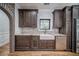Charming kitchen sink beneath a window with granite countertops and stainless steel appliances at 16 Mountain Creek Ne Trl, Fairmount, GA 30139