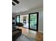 Living room view through large sliding glass doors to patio and pool at 16 Mountain Creek Ne Trl, Fairmount, GA 30139