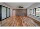 Open living room boasts brick wall, sliding glass doors, and backyard view at 16 Mountain Creek Ne Trl, Fairmount, GA 30139