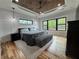 Main bedroom with wooden ceiling, hardwood floors, and large windows with natural light at 16 Mountain Creek Ne Trl, Fairmount, GA 30139