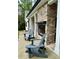 Covered patio featuring a stone fireplace and comfortable chairs overlooking the landscaped yard at 16 Mountain Creek Ne Trl, Fairmount, GA 30139