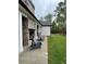 Outdoor patio with stone fireplace, comfortable seating, and view of the landscaped backyard at 16 Mountain Creek Ne Trl, Fairmount, GA 30139