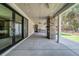 Spacious covered patio with stone fireplace, stainless steel grill, and outdoor access at 16 Mountain Creek Ne Trl, Fairmount, GA 30139