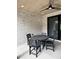 Covered patio with a dining table, chairs, and ceiling fan offering comfortable outdoor living at 16 Mountain Creek Ne Trl, Fairmount, GA 30139