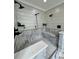 Luxurious bathroom shower with multiple shower heads, a built-in bench, and stylish tile at 16 Mountain Creek Ne Trl, Fairmount, GA 30139
