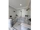 Spacious walk-in shower featuring marble and tile, built-in benches, and dual shower heads, providing a spa-like experience at 16 Mountain Creek Ne Trl, Fairmount, GA 30139