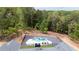 Overhead angle of an in ground pool and lounge seating, as seen from the roof of a modern home at 16 Mountain Creek Ne Trl, Fairmount, GA 30139