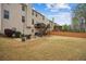 Lovely backyard with an elevated deck, a fire pit and chairs creating a cozy outdoor seating area at 2710 Irwin Ct, Cumming, GA 30041