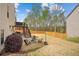 Home backyard showcasing a deck with stairs, a fire pit seating area, and a lush lawn at 2710 Irwin Ct, Cumming, GA 30041