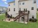 Attractive backyard view showcasing a private deck, patio with a fire pit, and a well-maintained lawn at 2710 Irwin Ct, Cumming, GA 30041
