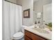 Clean bathroom featuring a white vanity, a framed mirror, and shower with curtain at 2710 Irwin Ct, Cumming, GA 30041