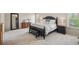 Spacious bedroom features neutral carpeting, ensuite with dresser and large mirror, and plenty of natural light at 2710 Irwin Ct, Cumming, GA 30041