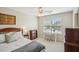 Cozy bedroom featuring neutral walls, a ceiling fan, a work space, and natural light at 2710 Irwin Ct, Cumming, GA 30041