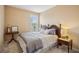 Cozy bedroom featuring a queen bed, neutral tones, and natural light at 2710 Irwin Ct, Cumming, GA 30041