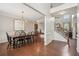 Elegant dining room with hardwood floors, chandelier lighting, and staircase at 2710 Irwin Ct, Cumming, GA 30041