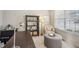 Stylish home office space with a comfortable chair, functional desk, and calming natural light at 2710 Irwin Ct, Cumming, GA 30041