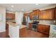 Spacious kitchen with granite countertops, stainless steel appliances, and ample cabinet space at 2710 Irwin Ct, Cumming, GA 30041