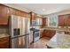 Beautiful kitchen featuring granite countertops, stainless steel appliances, and wood flooring at 2710 Irwin Ct, Cumming, GA 30041
