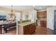 Stylish eat-in kitchen with island and dining table adjacent to the living room at 2710 Irwin Ct, Cumming, GA 30041