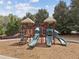 Fun community playground featuring slides, climbing structures, and a soft landing surface for safety at 2710 Irwin Ct, Cumming, GA 30041