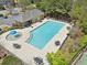 Aerial view of the community pool with ample seating, tables, and an umbrella splash fountain at 2710 Irwin Ct, Cumming, GA 30041
