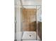 Shower stall featuring sleek glass doors, tiled walls, and a built-in showerhead at 2710 Irwin Ct, Cumming, GA 30041